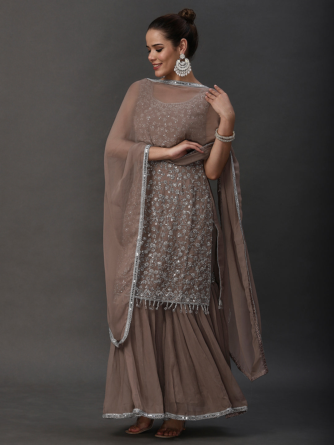 A beige ethnic party lehenga with intricate round neck embroidery from PepaBai.